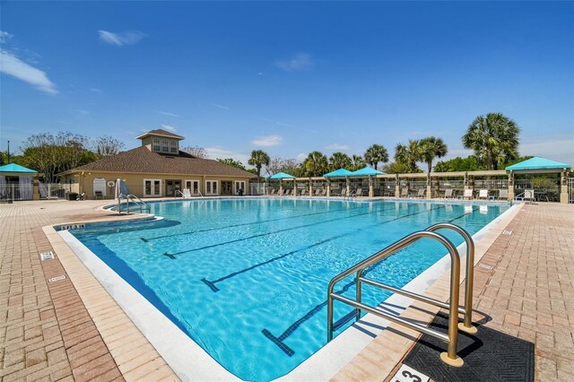 view of swimming pool with a patio