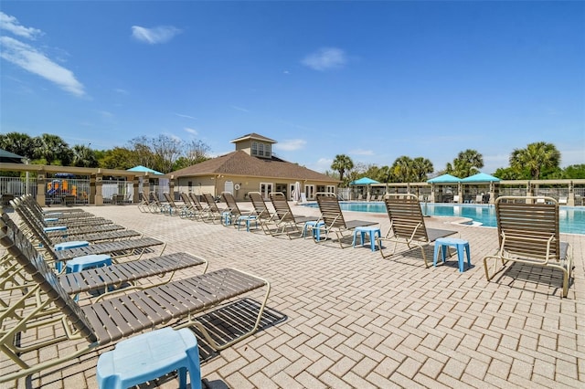 view of swimming pool featuring a patio area