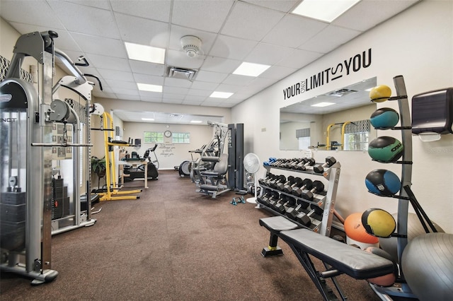 gym featuring a paneled ceiling