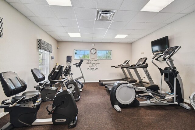 gym featuring a drop ceiling