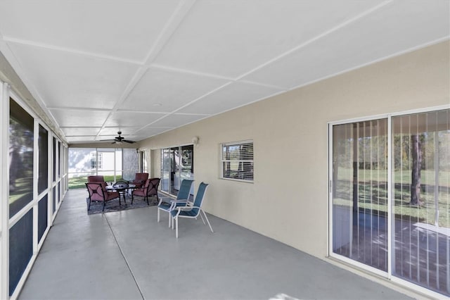 sunroom / solarium featuring ceiling fan