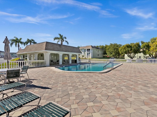 view of pool featuring a patio