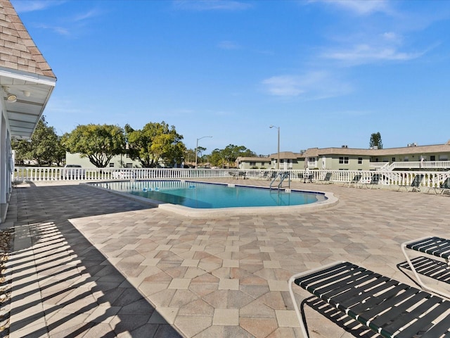 view of pool featuring a patio area