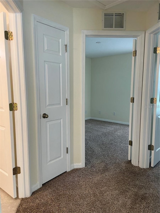 corridor with carpet flooring