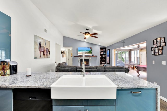 kitchen with sink, vaulted ceiling, dark hardwood / wood-style floors, ceiling fan, and pool table