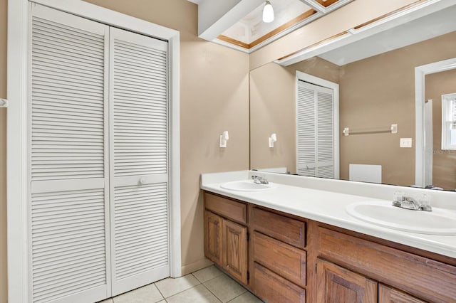 bathroom with tile patterned flooring and vanity