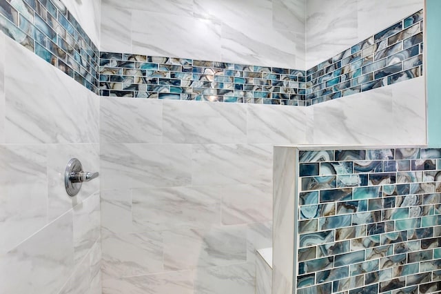 bathroom with a tile shower