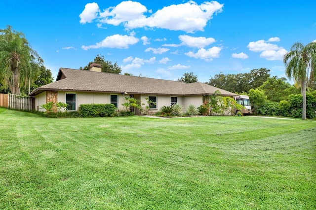 view of front of property with a front lawn