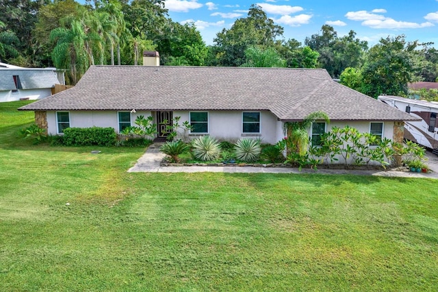 ranch-style home featuring a front yard