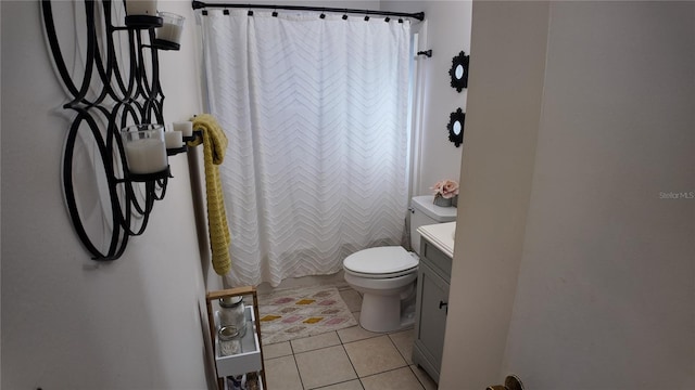 bathroom featuring tile patterned flooring, vanity, toilet, and a shower with shower curtain