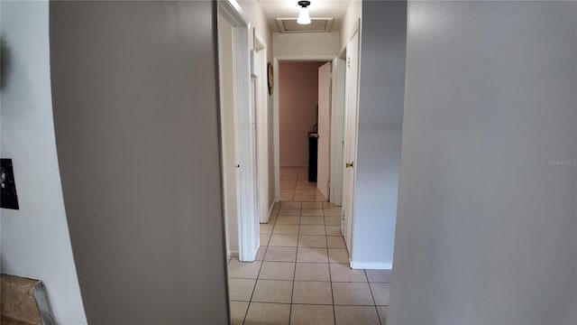 hallway featuring light tile patterned floors