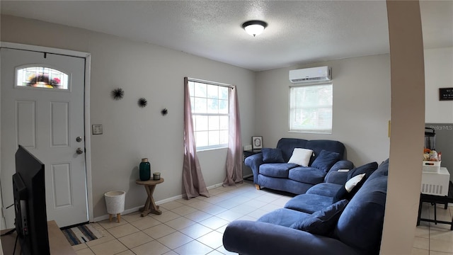 tiled living room with a textured ceiling and a wall mounted air conditioner