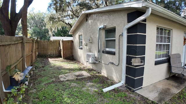 view of home's exterior with ac unit