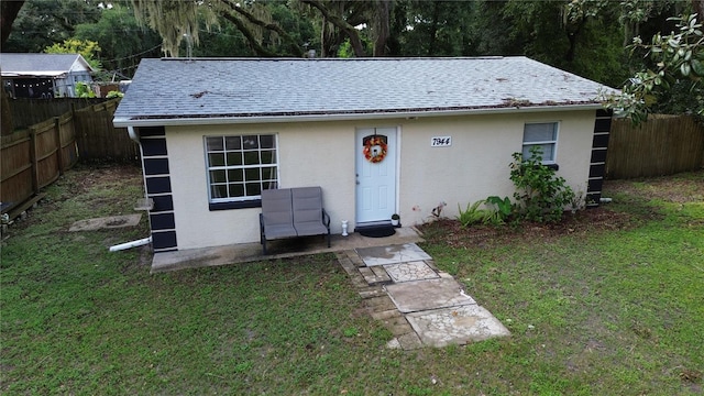 view of outbuilding featuring a yard