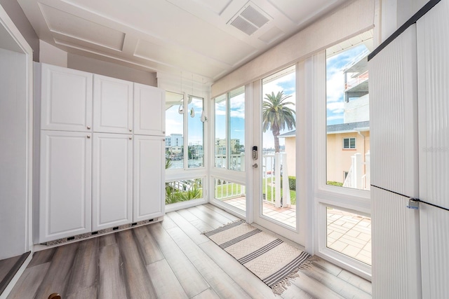 unfurnished sunroom with a healthy amount of sunlight