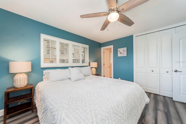 bedroom featuring a closet, ceiling fan, and dark wood-type flooring