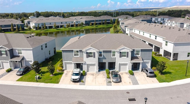 drone / aerial view featuring a water view