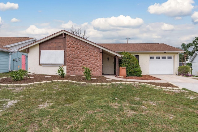 view of front of property featuring a garage and a front lawn