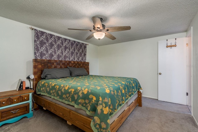 carpeted bedroom with ceiling fan and a textured ceiling