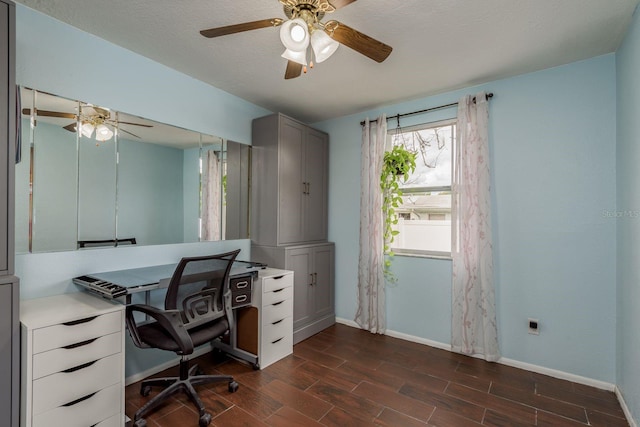 office space with ceiling fan, dark hardwood / wood-style floors, and a textured ceiling