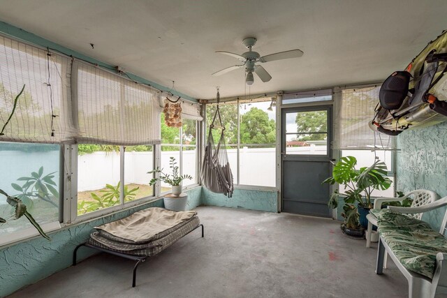 sunroom / solarium with ceiling fan