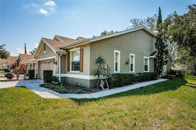 view of front of home with a garage and a front yard