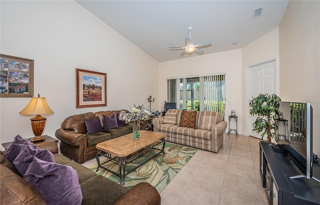 tiled living room featuring lofted ceiling and ceiling fan