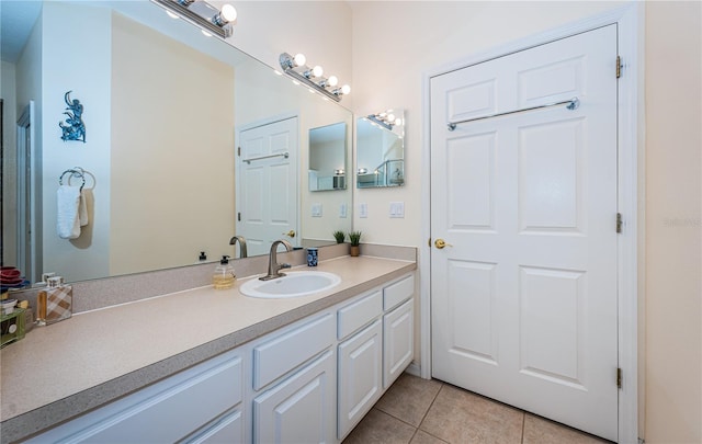 bathroom featuring vanity and tile patterned flooring