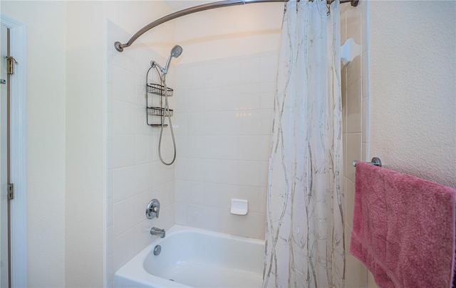 bathroom with shower / bathtub combination with curtain