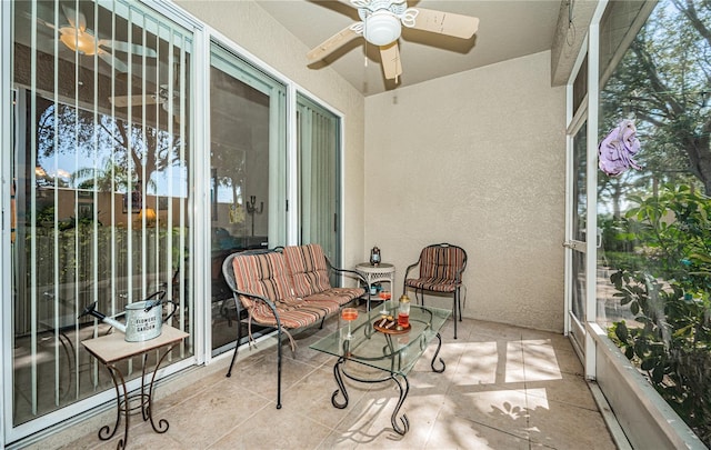 sunroom / solarium with ceiling fan