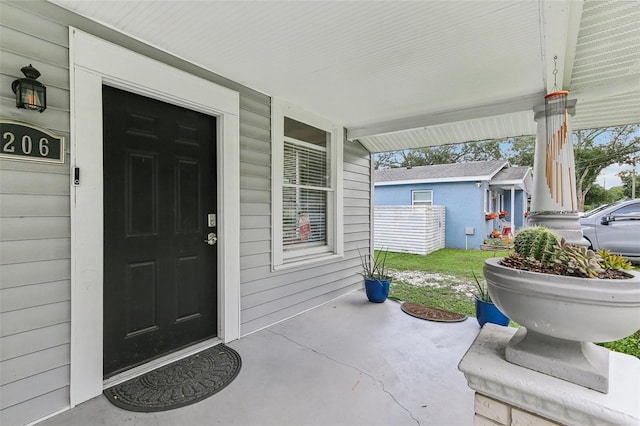 doorway to property featuring a porch