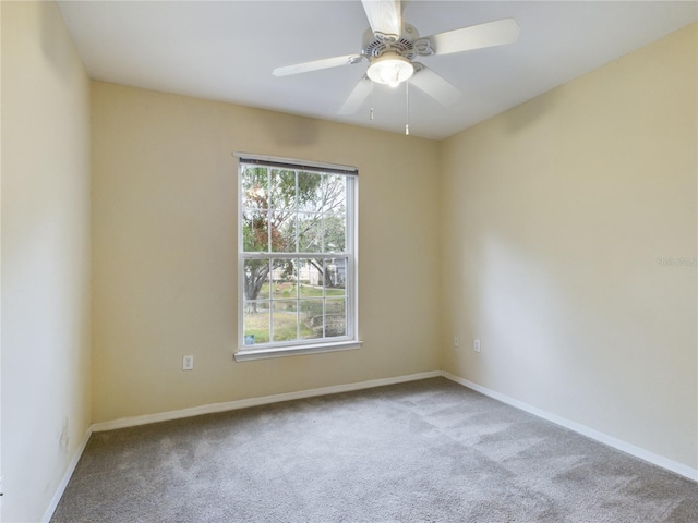 carpeted empty room with ceiling fan