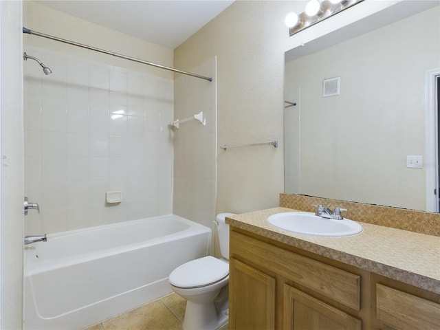 full bathroom featuring toilet, tile patterned floors, vanity, and bathing tub / shower combination