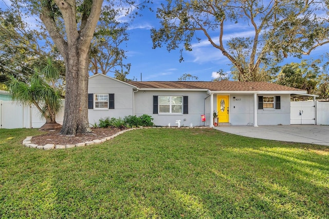 ranch-style home with a front lawn