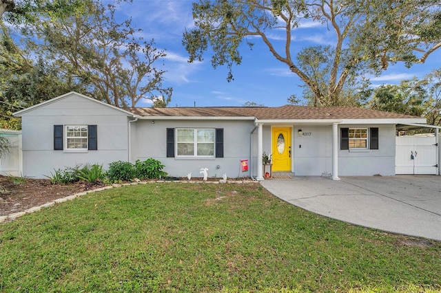 ranch-style home featuring a front yard