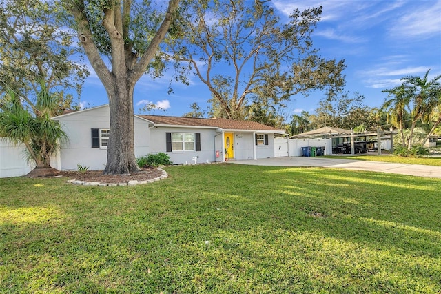 ranch-style home featuring a front yard