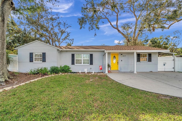 single story home featuring a front yard