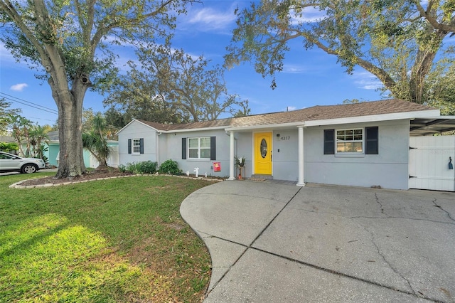 ranch-style home with a front lawn