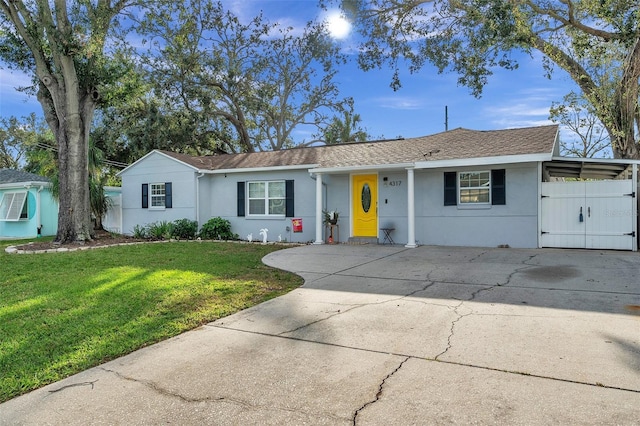 ranch-style home featuring a front yard