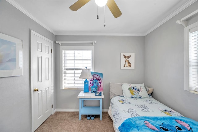 bedroom with carpet, crown molding, and ceiling fan