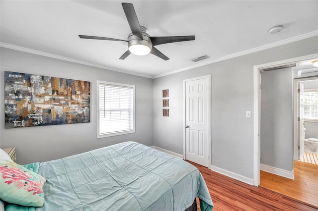 bedroom with ceiling fan, hardwood / wood-style flooring, and ornamental molding