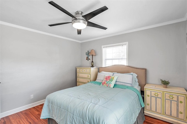 bedroom with crown molding, dark hardwood / wood-style floors, and ceiling fan