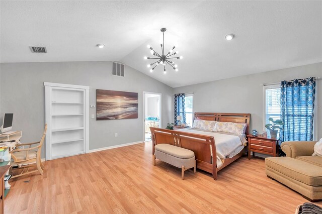 bedroom featuring lofted ceiling, a notable chandelier, multiple windows, and light hardwood / wood-style floors