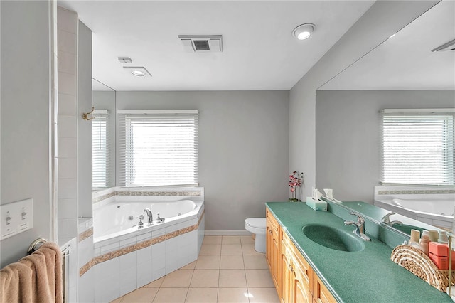 bathroom featuring radiator heating unit, toilet, tiled tub, vanity, and tile patterned flooring