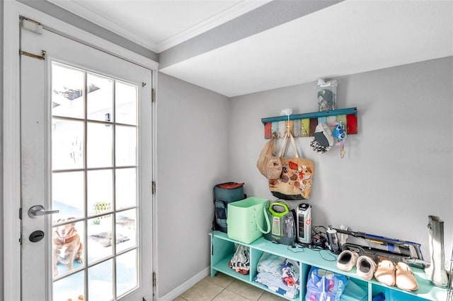 mudroom with ornamental molding and light tile patterned floors