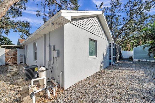 view of home's exterior with central AC