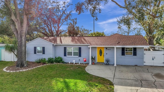 ranch-style home with a front lawn