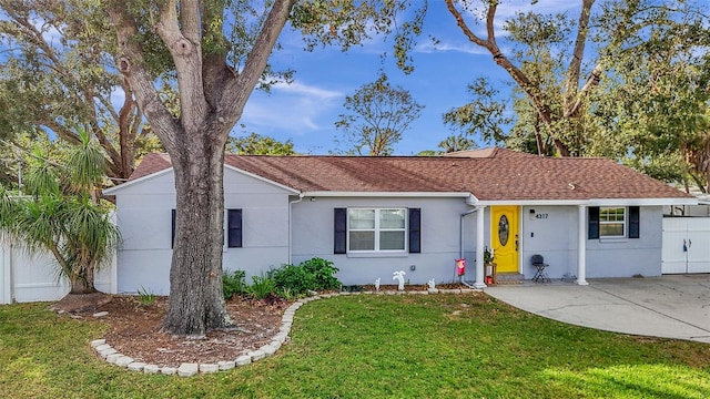 ranch-style home with a front lawn