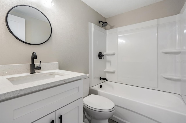 full bathroom featuring vanity, washtub / shower combination, and toilet