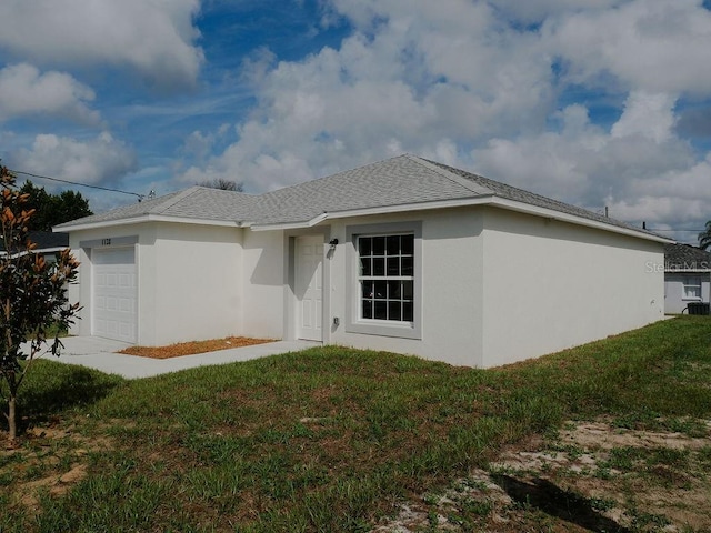 view of side of home featuring a lawn